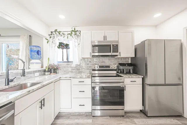 a view of a hallway with a white walls