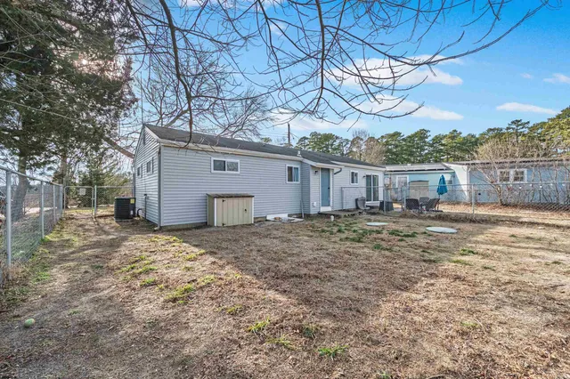 a view of a house with a yard and garage