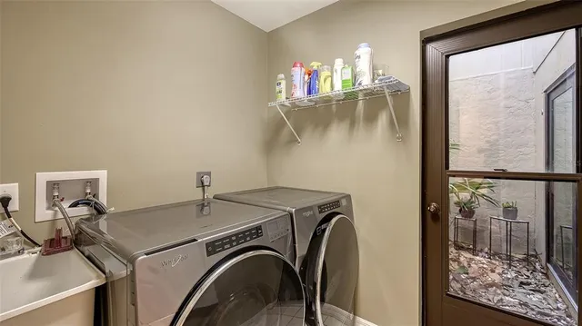 a utility room with dryer and washer