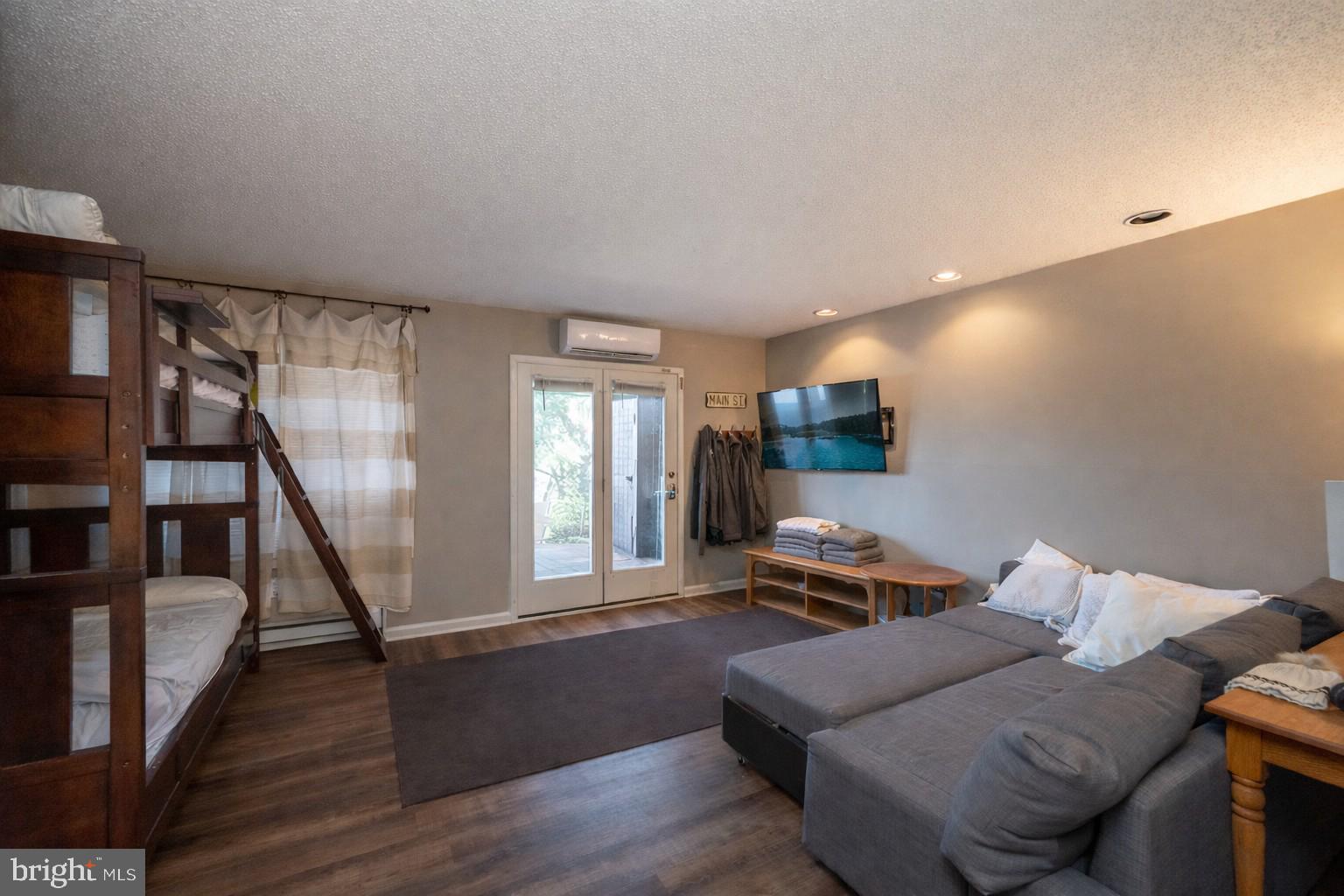 257 Marsh Hill Road, Unit 27 McHenry, MD 21541 - Photo 16 of 64 a living room with furniture and a wooden floor