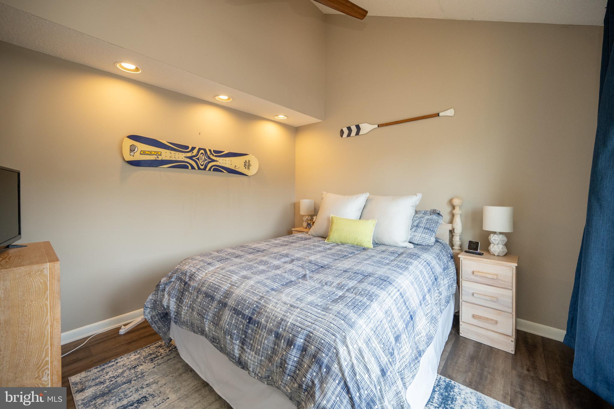 257 Marsh Hill Road, Unit 27 McHenry, MD 21541 - Photo 19 of 64 a bedroom with a bed and wooden floor