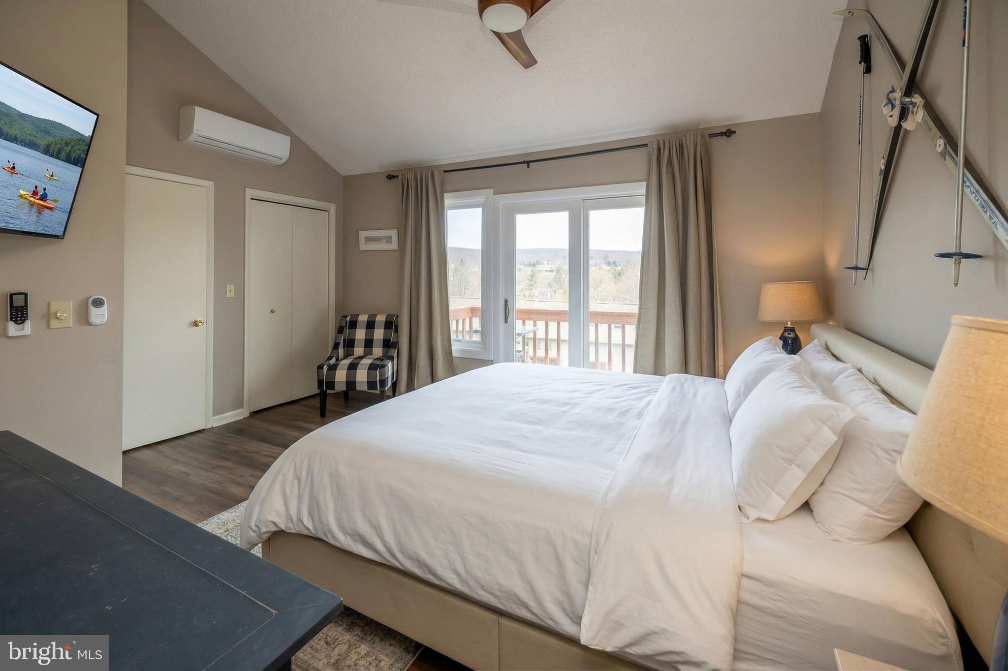257 Marsh Hill Road, Unit 27 McHenry, MD 21541 - Photo 26 of 64 a bedroom with a bed and a window