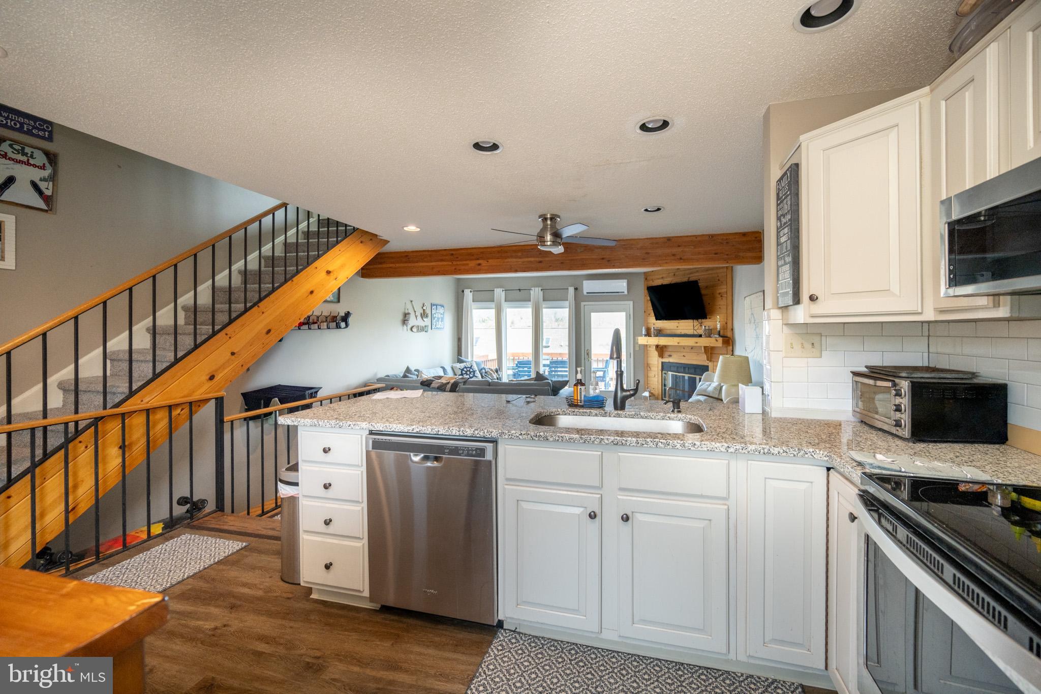 257 Marsh Hill Road, Unit 27 McHenry, MD 21541 - Photo 3 of 64 a kitchen with stainless steel appliances granite countertop a stove and a sink