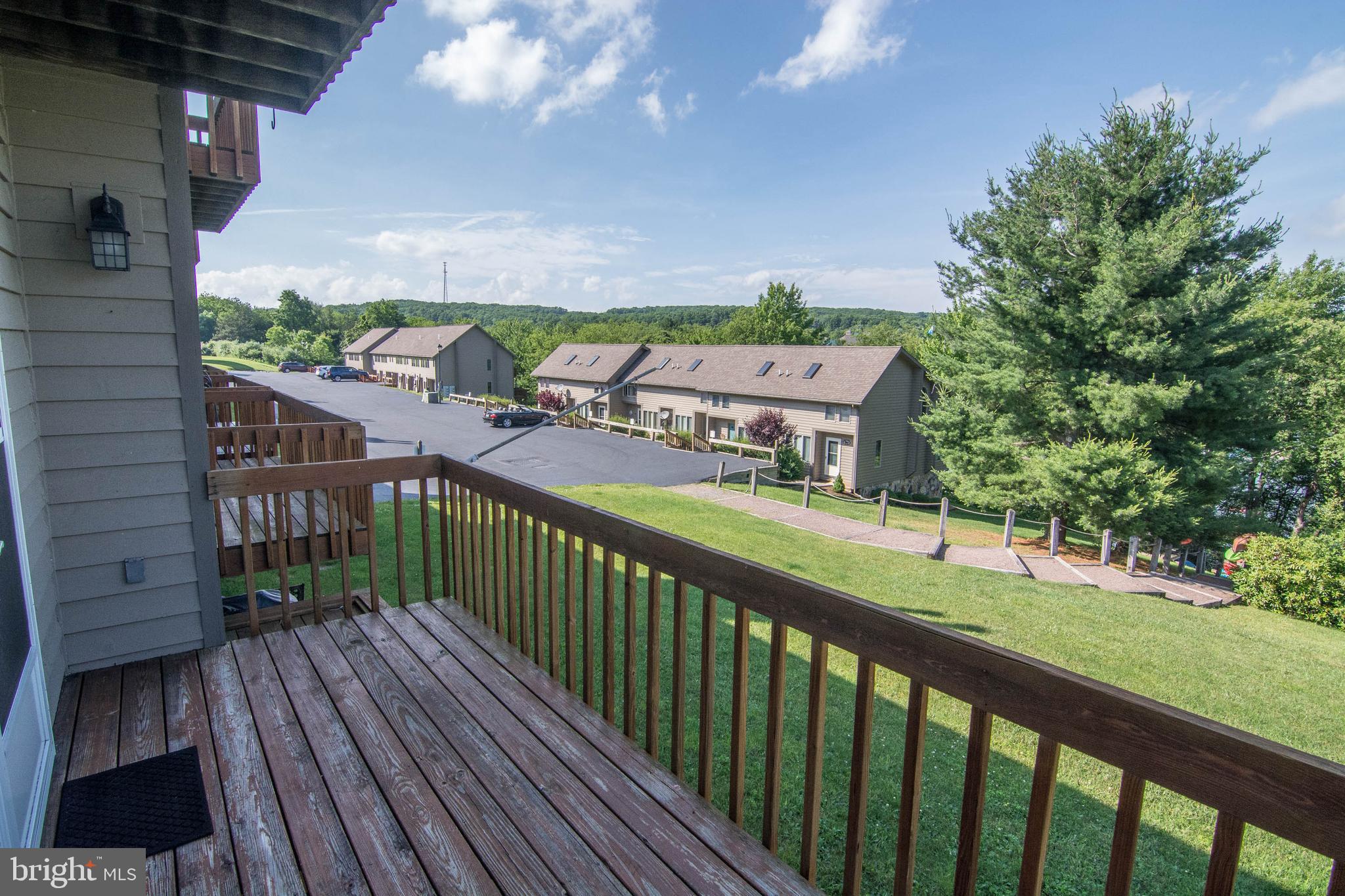 257 Marsh Hill Road, Unit 27 McHenry, MD 21541 - Photo 52 of 64 a view of a balcony with wooden floor