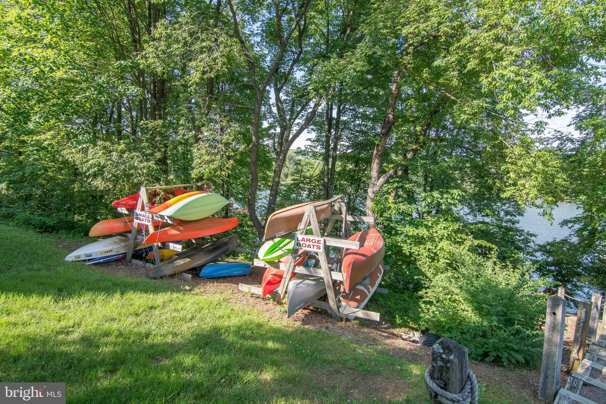 257 Marsh Hill Road, Unit 27 McHenry, MD 21541 - Photo 56 of 64 a backyard of a house with seating space and entertaining space