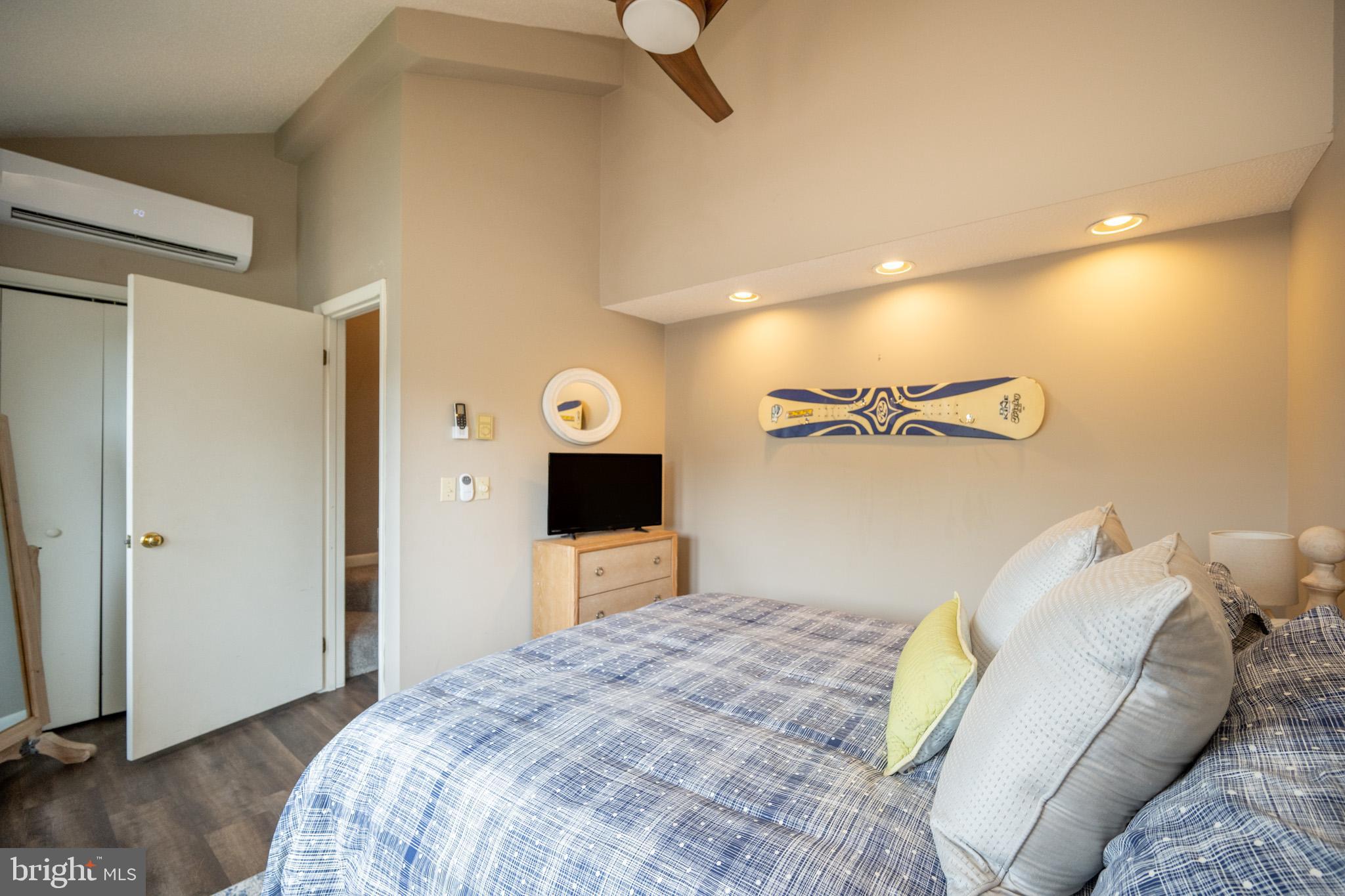 257 Marsh Hill Road, Unit 27 McHenry, MD 21541 - Photo 8 of 64 a bedroom with a bed and a television