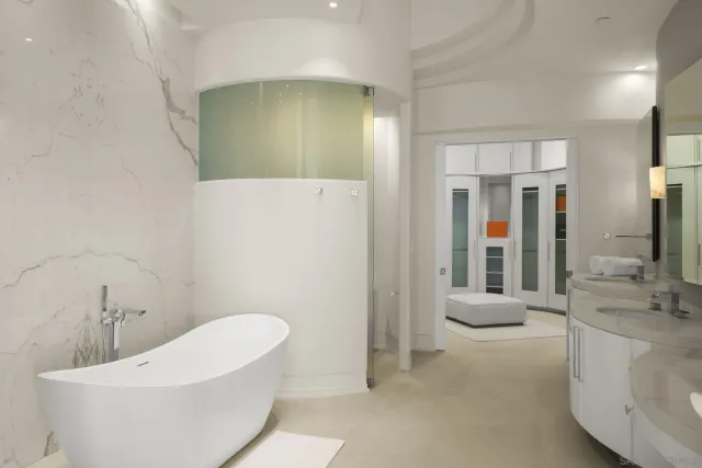 a view of an entryway with wooden floor and windows