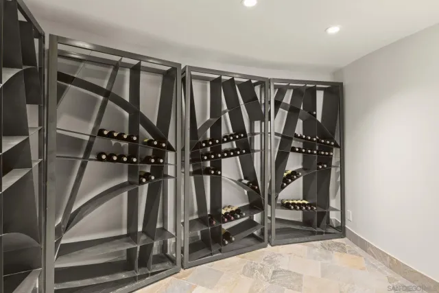 a living room with fireplace furniture and a potted plant