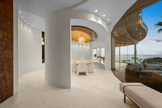 a bedroom with a bed and a ceiling fan