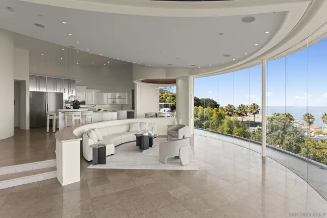 a kitchen with stainless steel appliances kitchen island granite countertop a refrigerator and a stove top oven