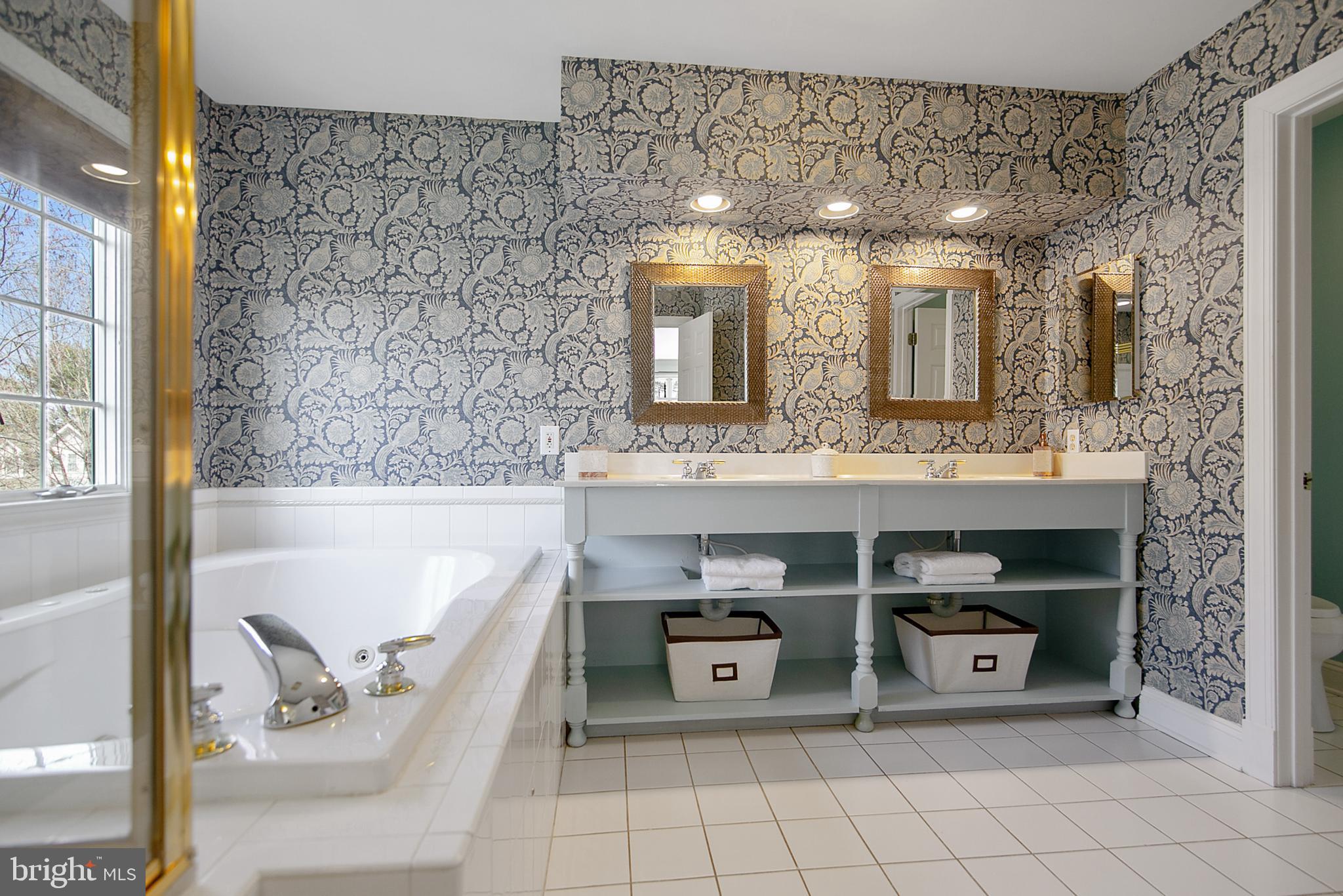 6400 Empty Song Road Columbia, MD 21044 - Photo 22 of 42 Dual sinks & walk-in shower w/bench