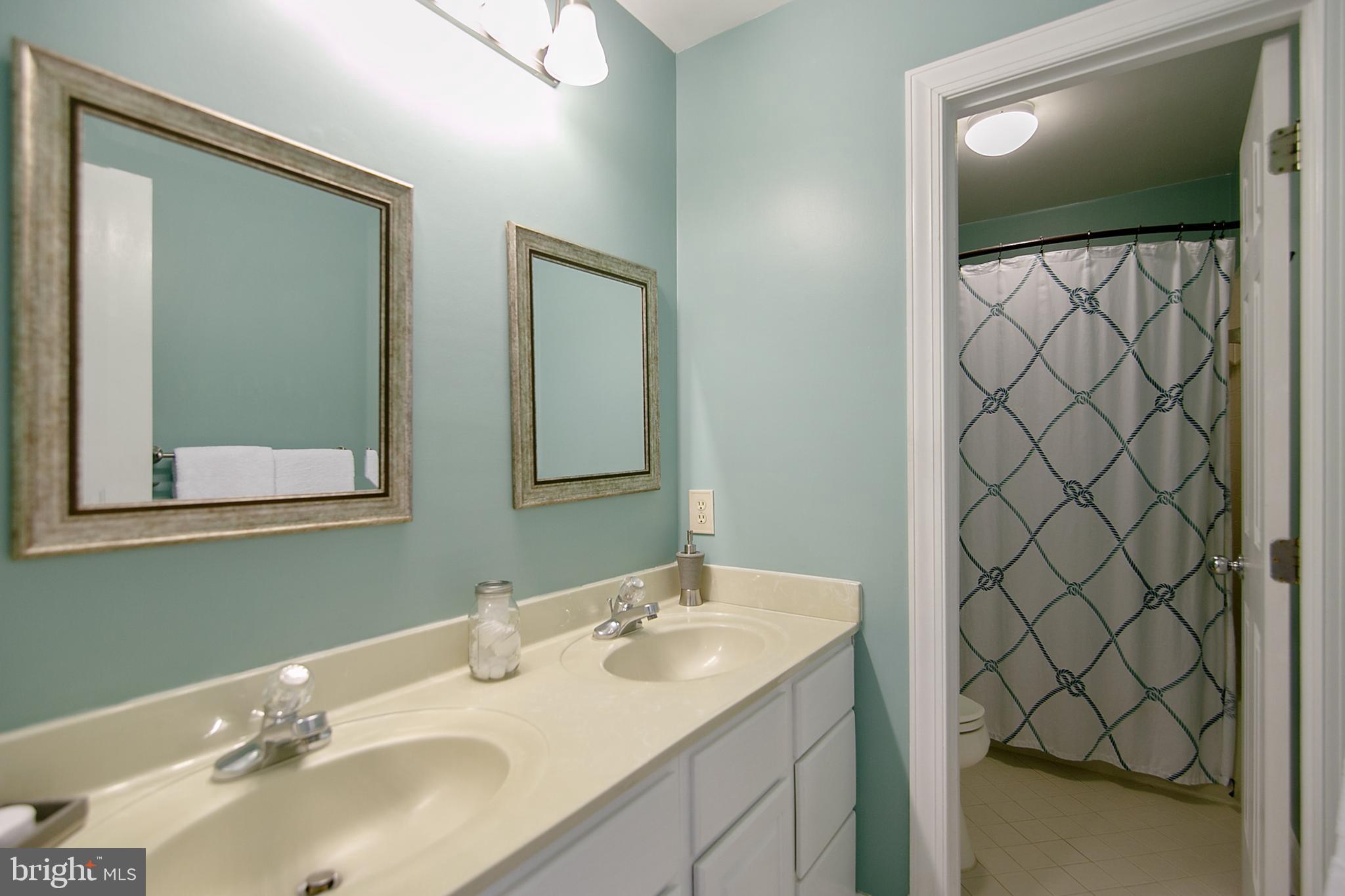 6400 Empty Song Road Columbia, MD 21044 - Photo 29 of 42 2nd full bathroom w/dual sinks & refinished vanity