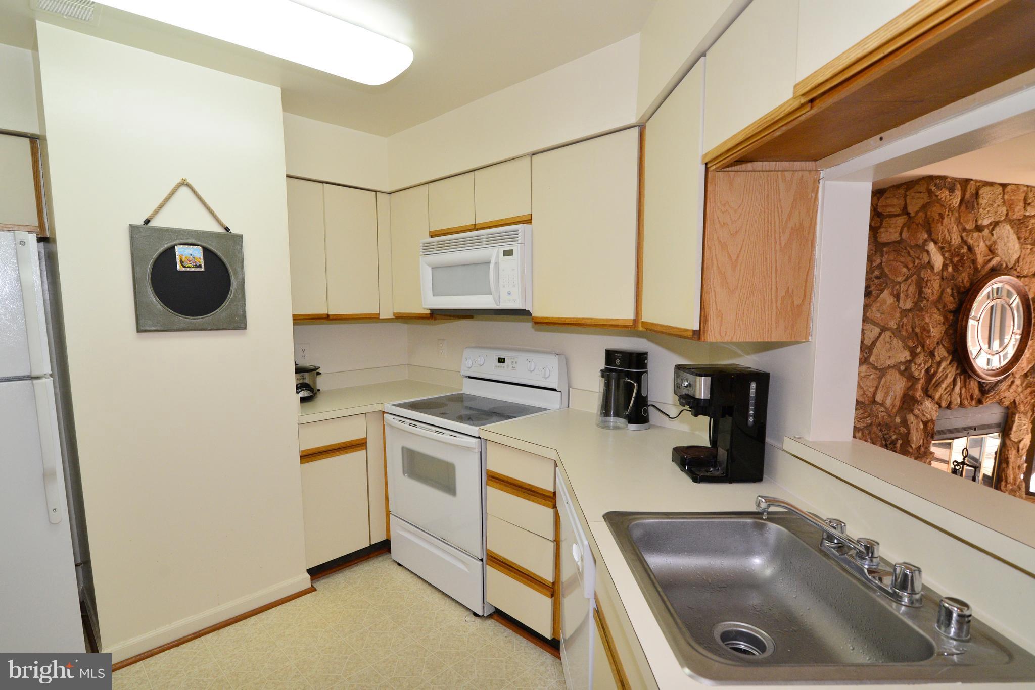 11220 Harbor Court, Unit 11220 Reston, VA 20191 - Photo 8 of 29 The Kitchen also opens to the Living Room.