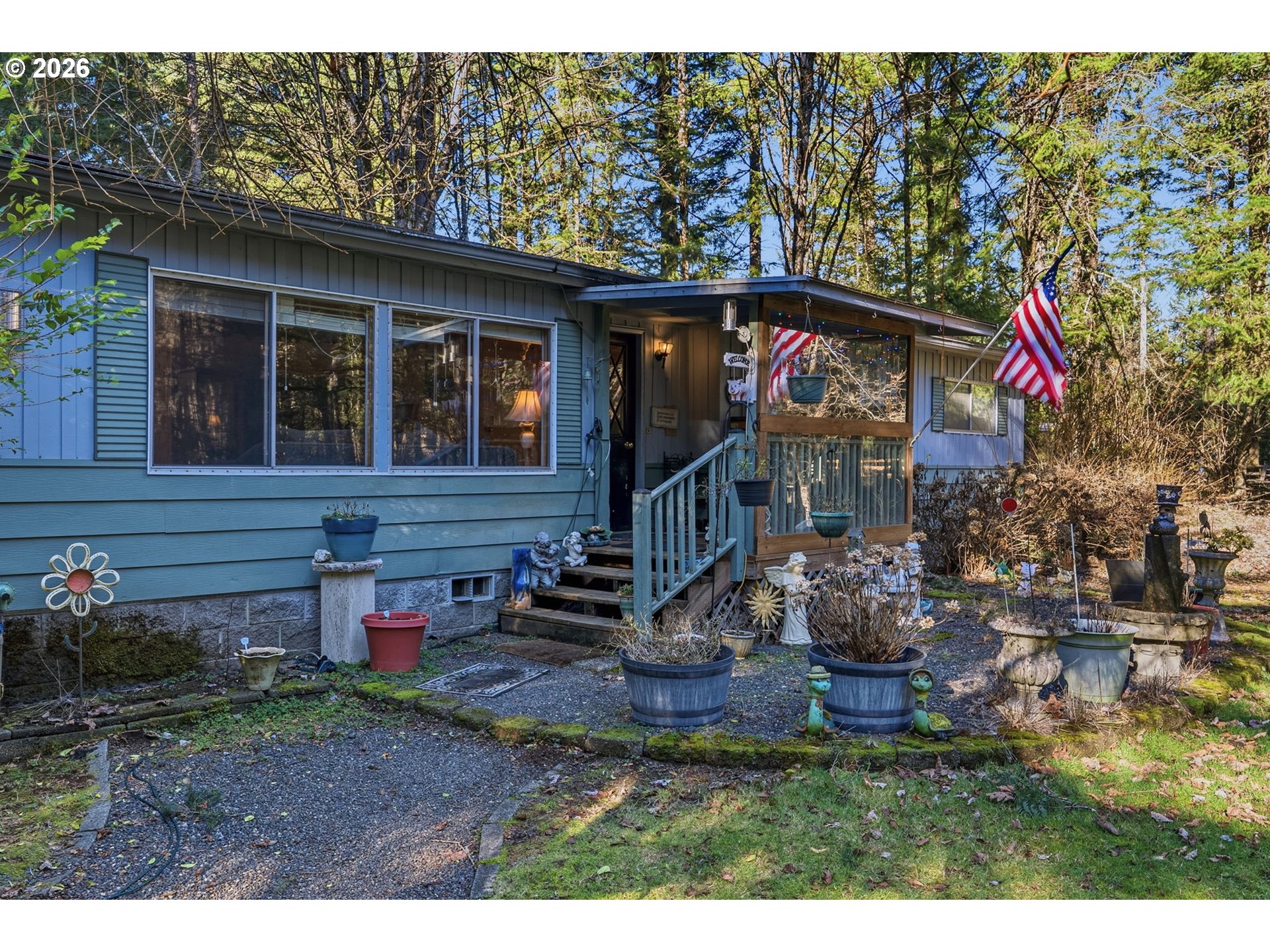 a view of house with backyard space and porch