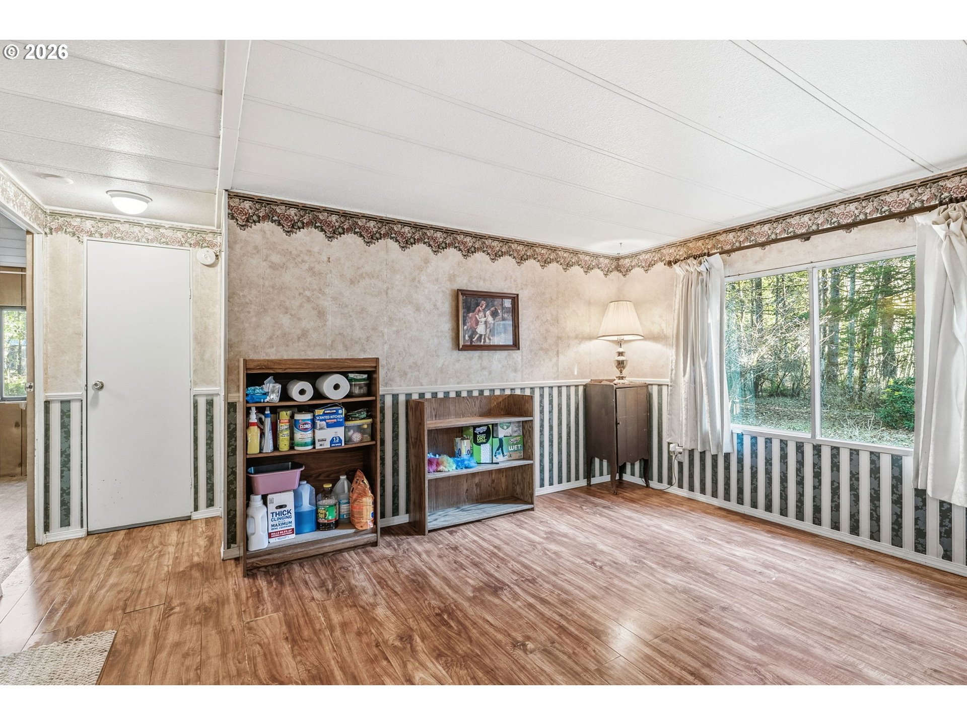 282 Panda Road Washougal, WA 98671 - Photo 14 of 18 a view interior of a house with wooden floor a fireplace and a window