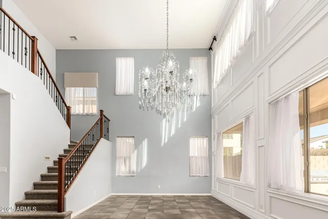 a view of an empty room with a fireplace and a window