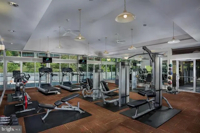a bathroom with a toilet mirror and sink