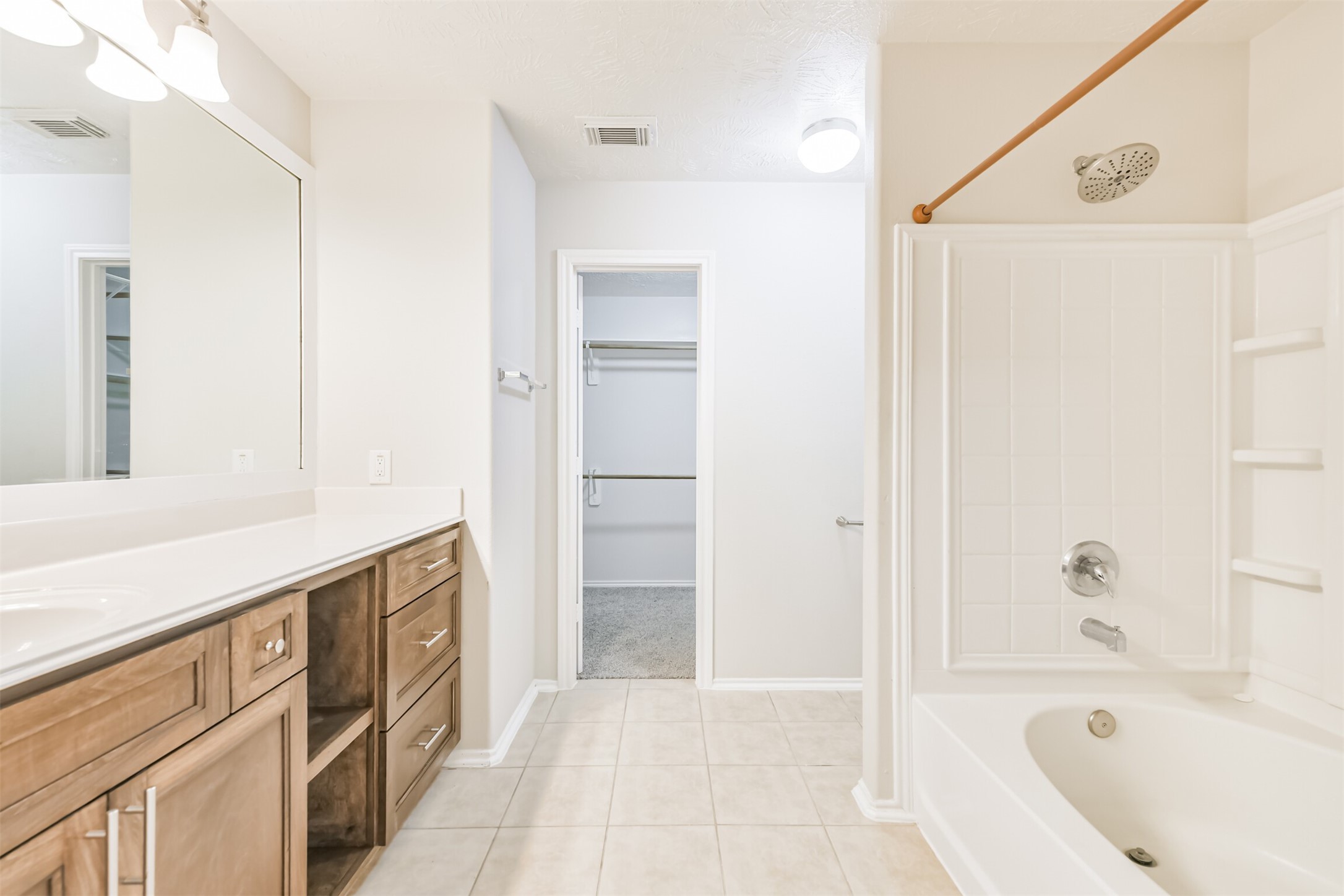 15023 Roche Rock Drive Humble, TX 77396 - Photo 26 of 40 a bathroom with a bathtub and a sink
