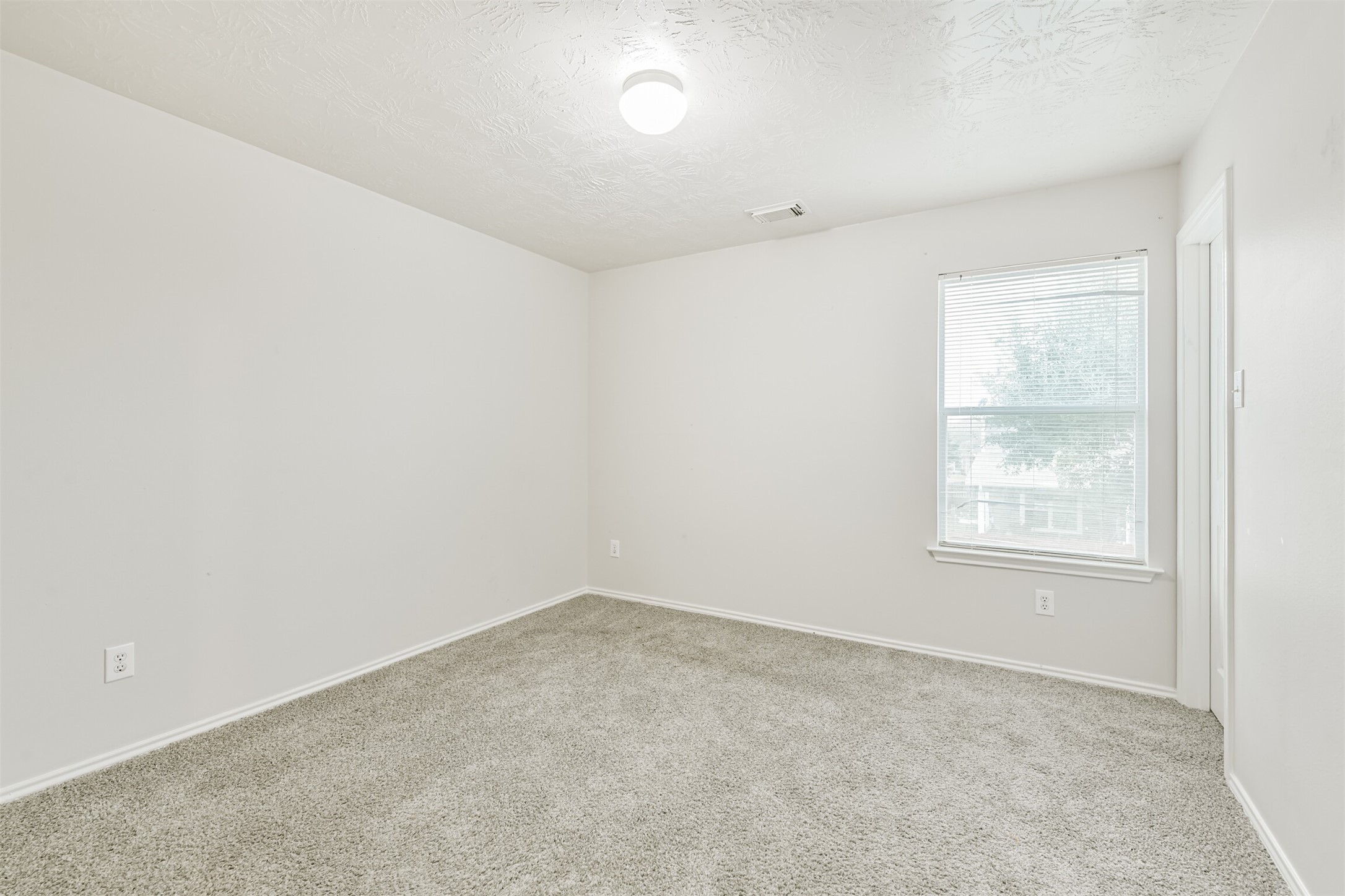 15023 Roche Rock Drive Humble, TX 77396 - Photo 30 of 40 an empty room with a window