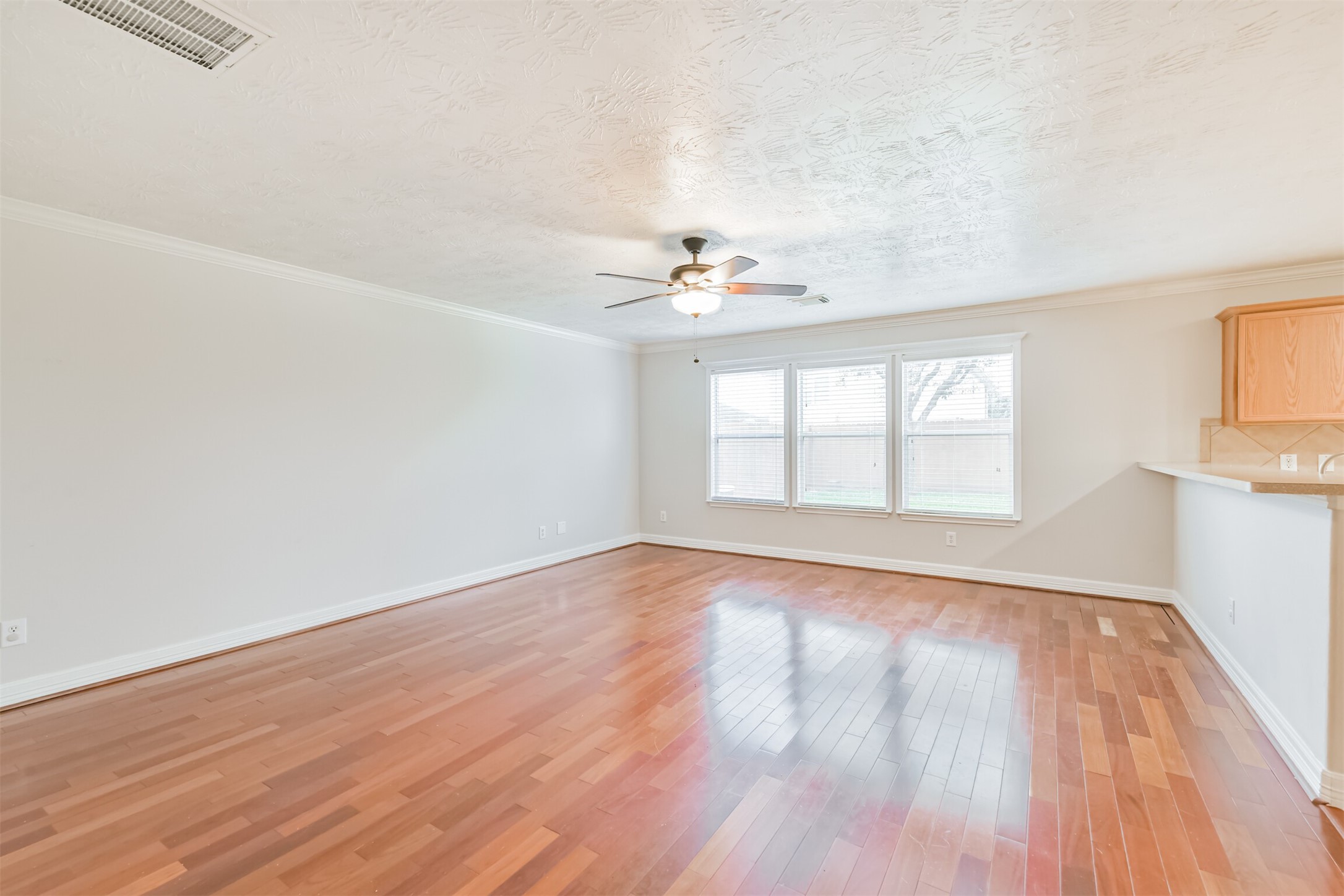 15023 Roche Rock Drive Humble, TX 77396 - Photo 4 of 40 wooden floor in an empty room with a window