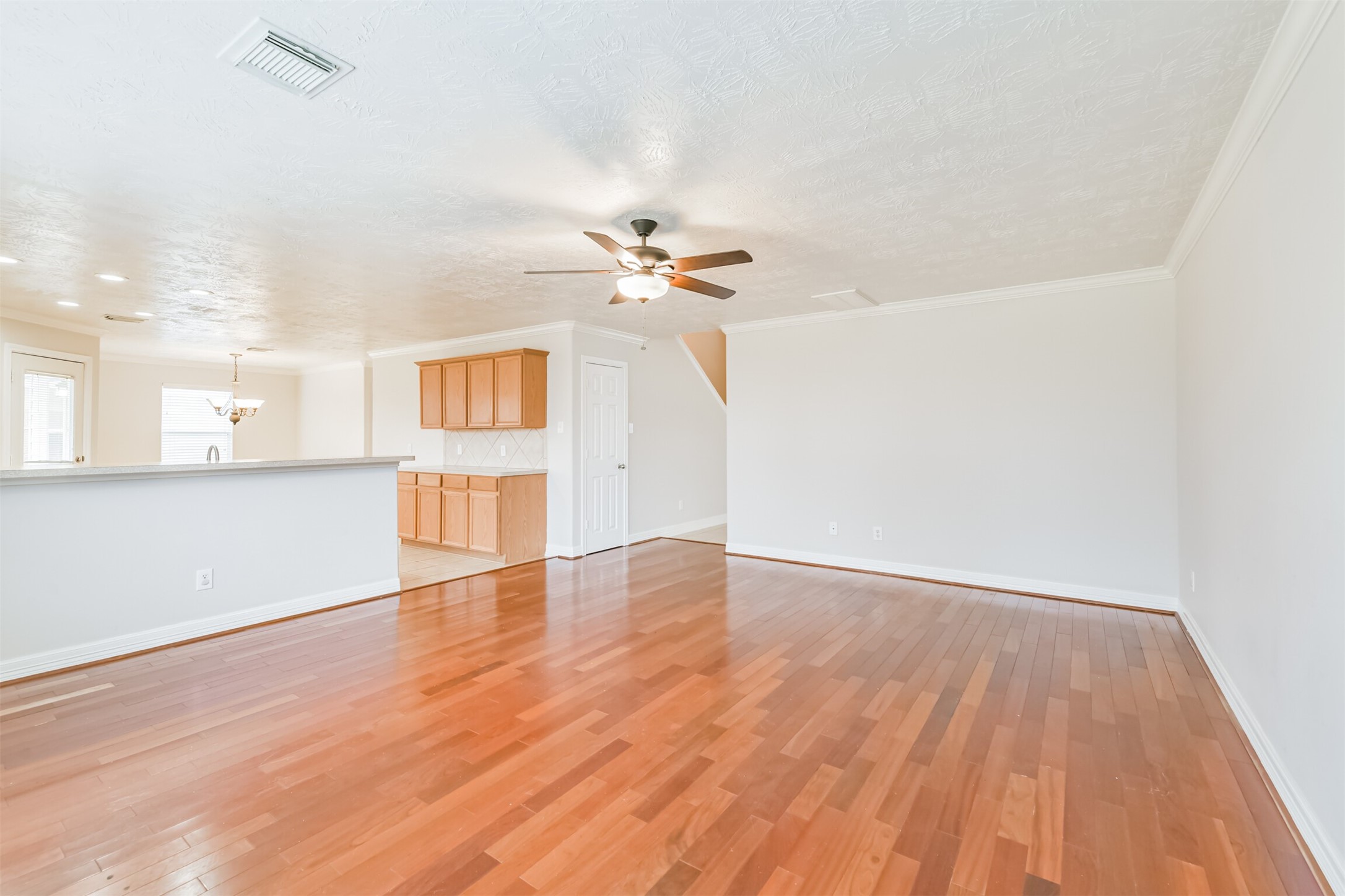 15023 Roche Rock Drive Humble, TX 77396 - Photo 6 of 40 a view of an empty room with a window and wooden floor