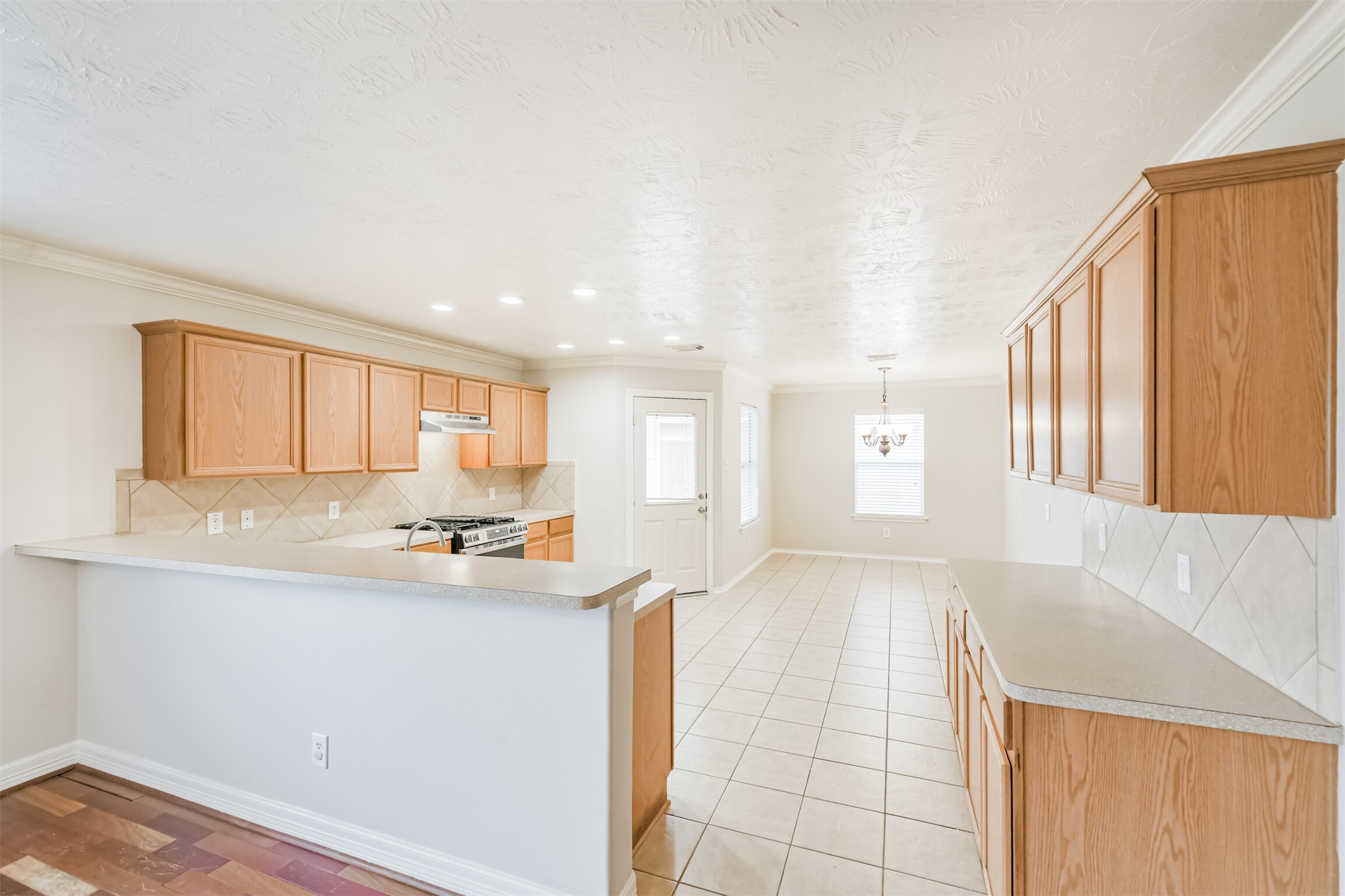 15023 Roche Rock Drive Humble, TX 77396 - Photo 7 of 40 a kitchen with stainless steel appliances granite countertop a sink and cabinets