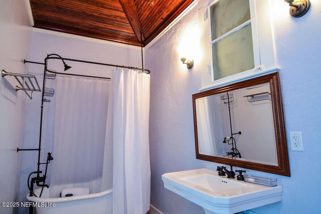 103 Beacon Street Interlachen, FL 32148 - Photo 14 of 31 a bathroom with a sink and a mirror