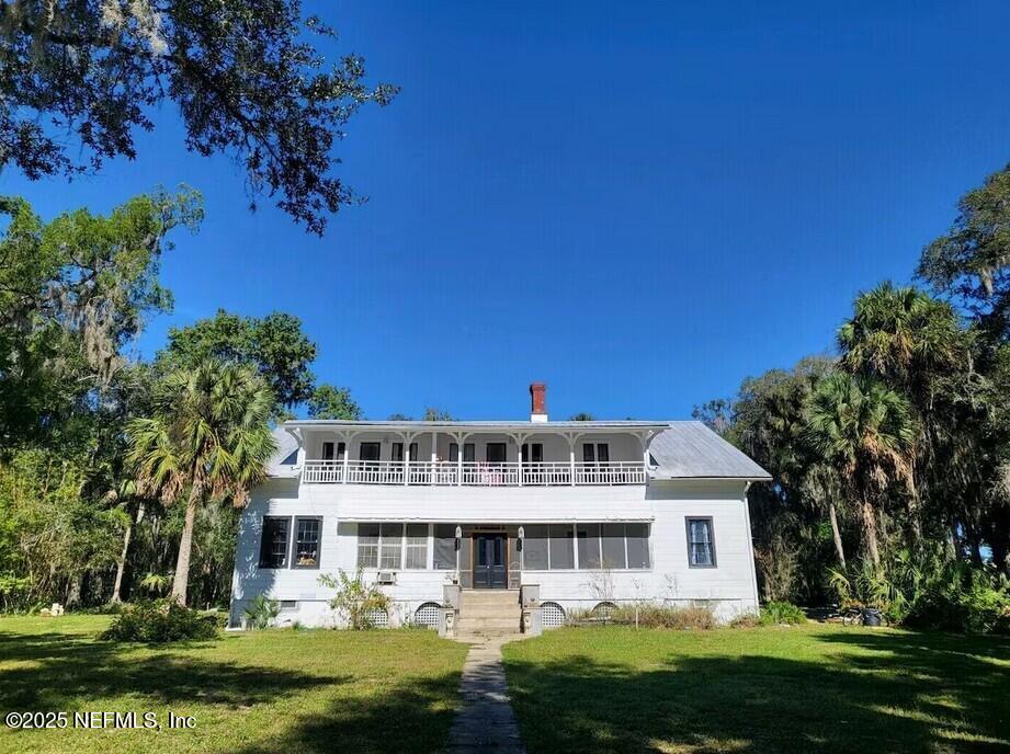 103 Beacon Street Interlachen, FL 32148 - Photo 20 of 30 front view of a house with a garden