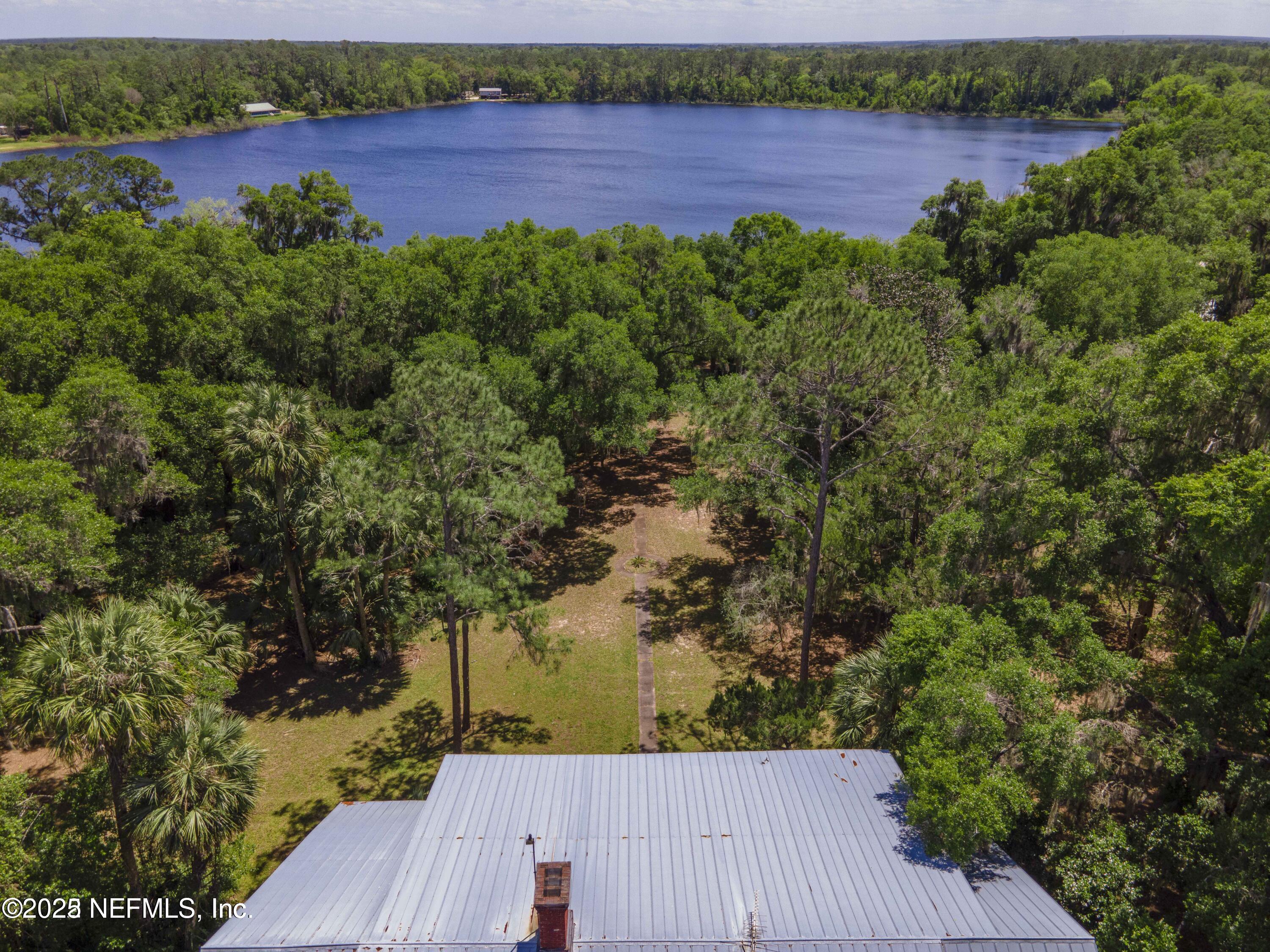103 Beacon Street Interlachen, FL 32148 - Photo 23 of 31 an aerial view of a house with a yard and lake view