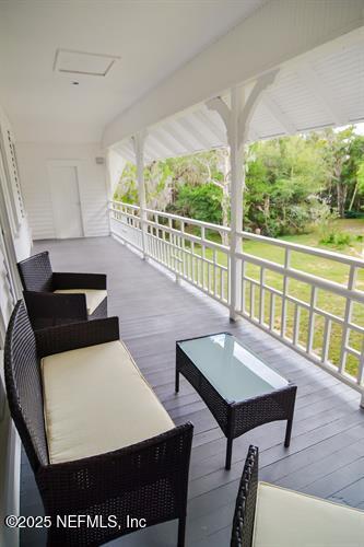 103 Beacon Street Interlachen, FL 32148 - Photo 8 of 31 a living room with furniture a large window and a table