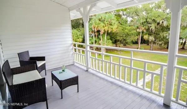a balcony with wooden floor