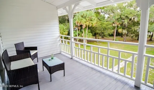 a balcony with wooden floor