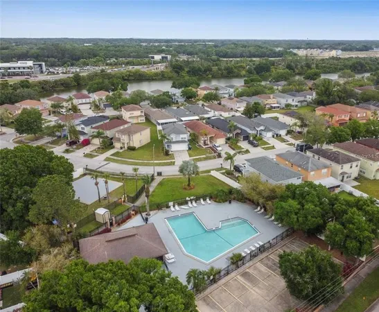 an aerial view of residential houses with outdoor space