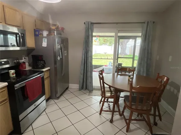 a view of a dining room with furniture window and outside view