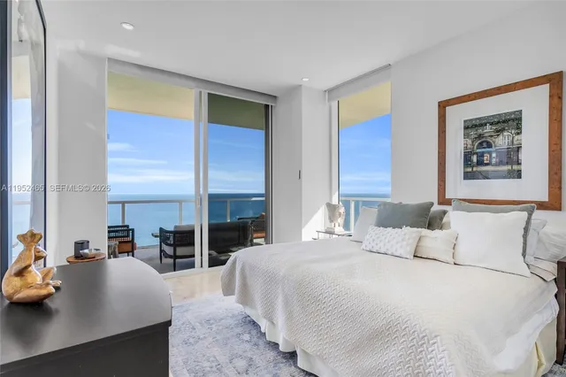 a bedroom with a large bed and a couch