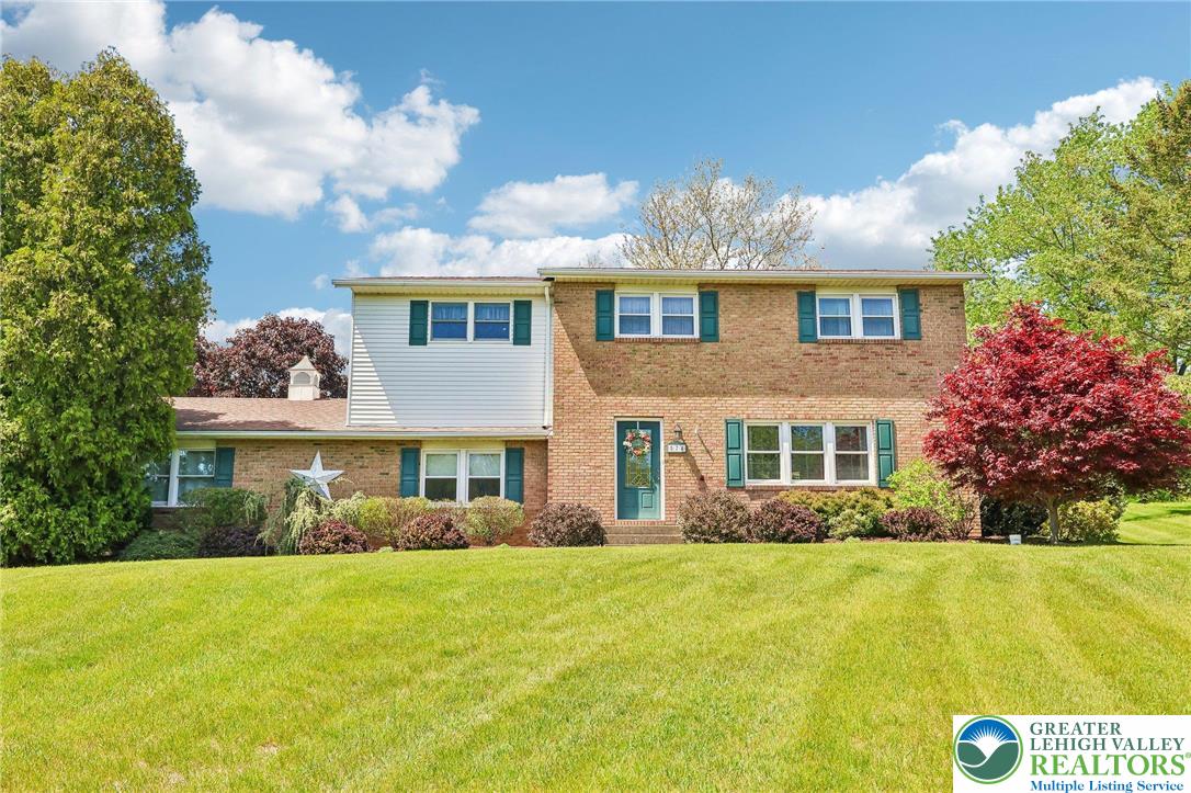 574 Carol Lane Bath, PA 18014 - Photo 1 of 46 a front view of a house with garden