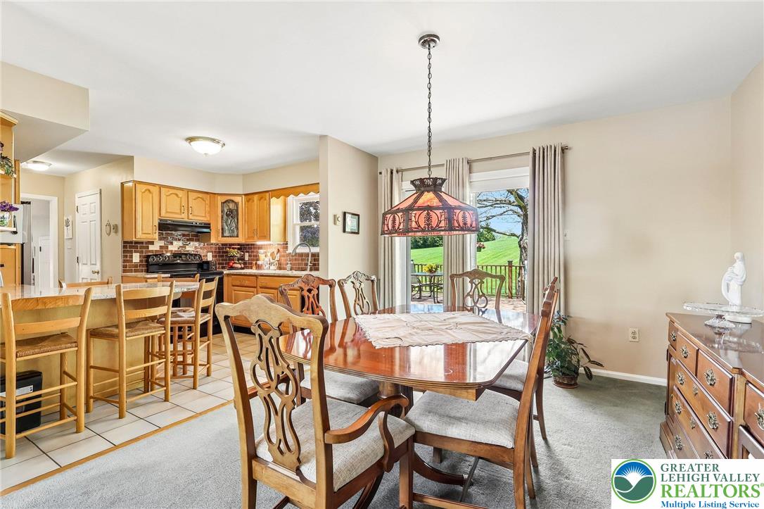 574 Carol Lane Bath, PA 18014 - Photo 12 of 46 a view of a dining room with furniture window and outside view