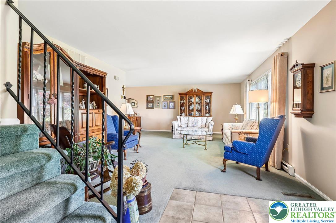 574 Carol Lane Bath, PA 18014 - Photo 22 of 46 a living room with furniture and a potted plant