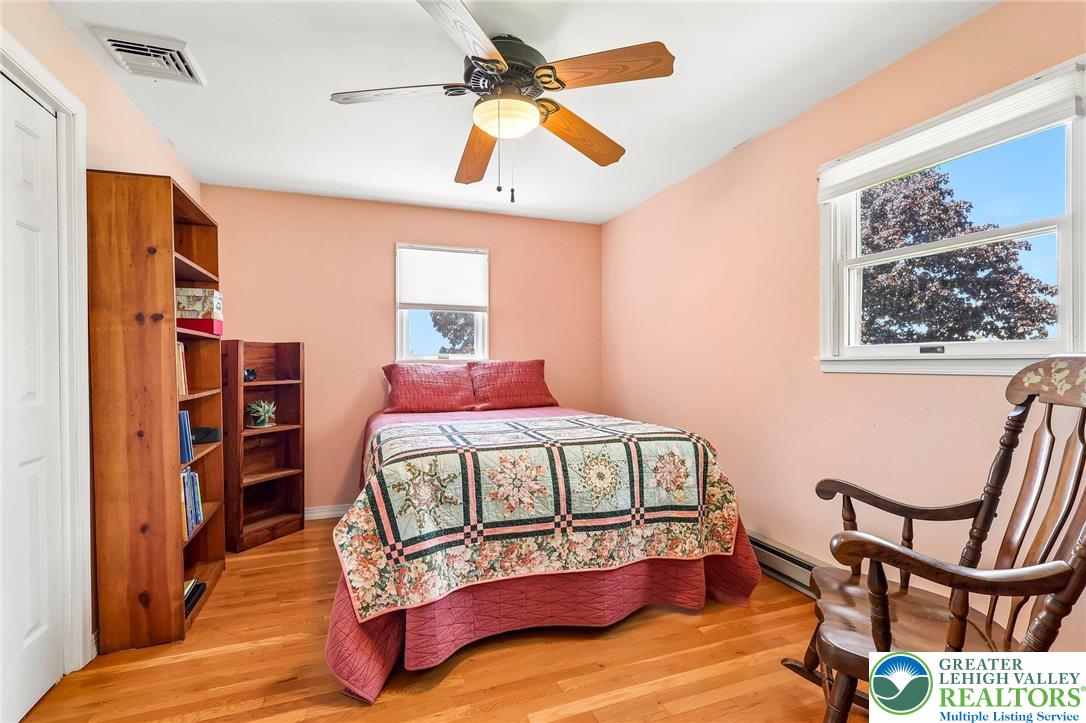 574 Carol Lane Bath, PA 18014 - Photo 23 of 46 a bedroom with a bed a window and book shelf