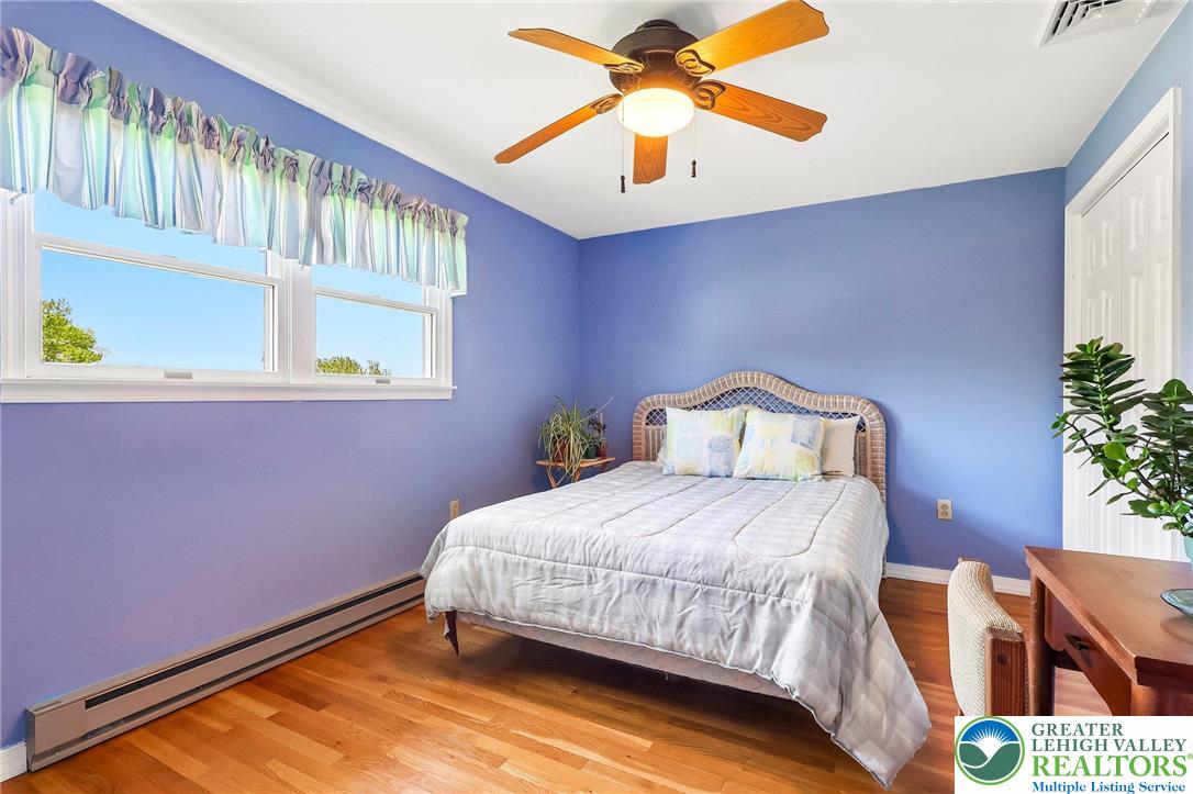574 Carol Lane Bath, PA 18014 - Photo 25 of 46 a bedroom with a bed and a potted plant