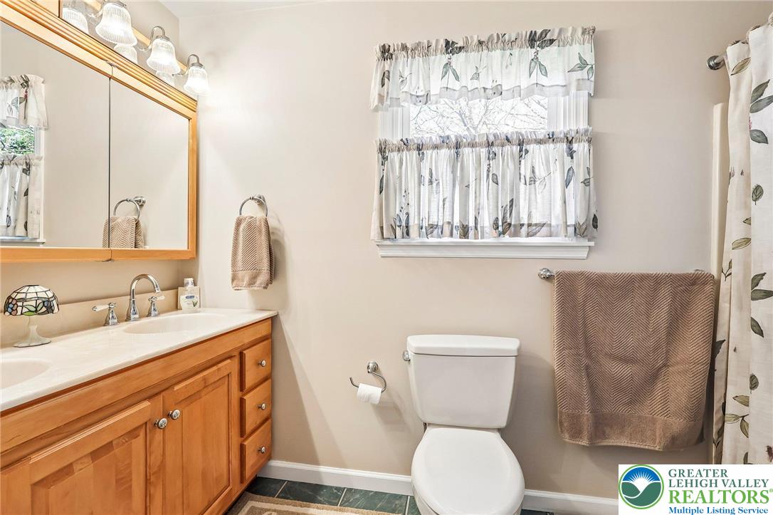 574 Carol Lane Bath, PA 18014 - Photo 27 of 46 a bathroom with a toilet sink and mirror