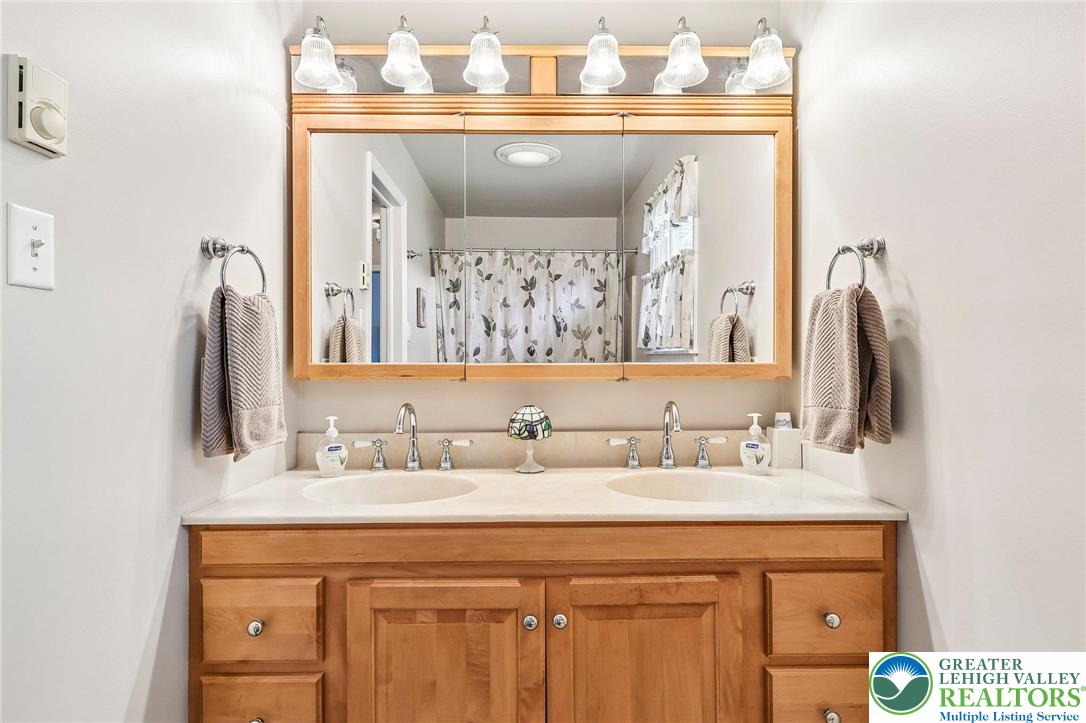 574 Carol Lane Bath, PA 18014 - Photo 28 of 46 a bathroom with a sink vanity and a mirror