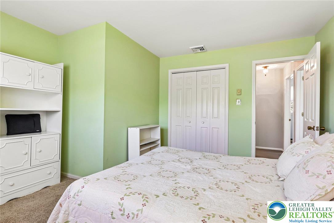 574 Carol Lane Bath, PA 18014 - Photo 29 of 46 a bedroom with a bed and a flat screen tv