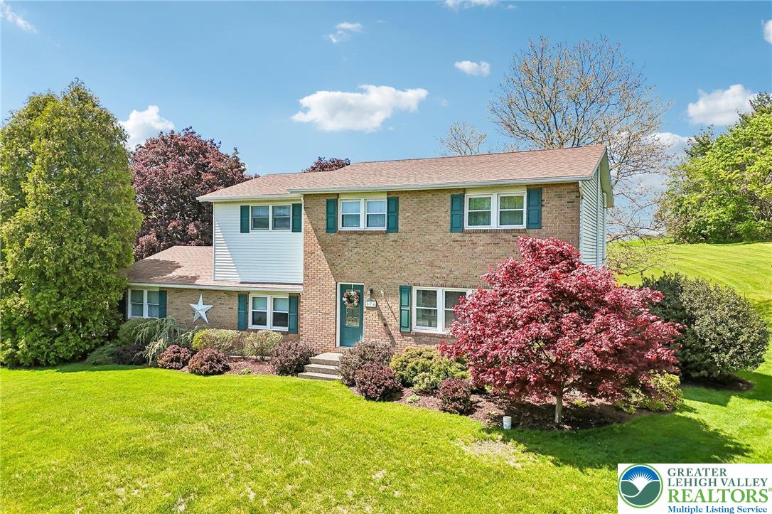 574 Carol Lane Bath, PA 18014 - Photo 4 of 46 a front view of a house with garden