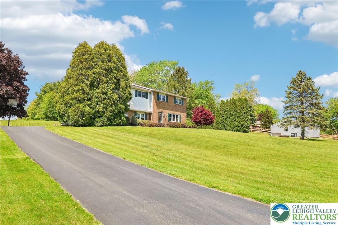 574 Carol Lane Bath, PA 18014 - Photo 5 of 46 a view of an swimming pool with an outdoor space and seating area