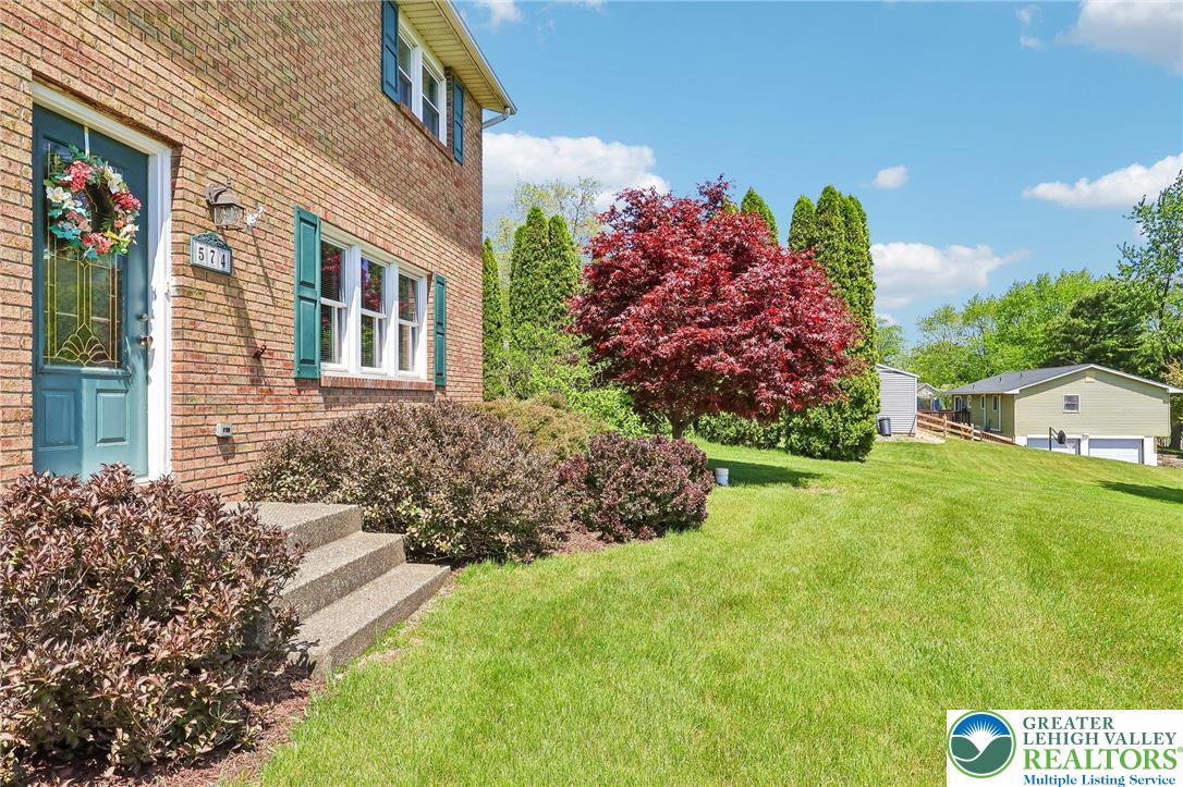 574 Carol Lane Bath, PA 18014 - Photo 7 of 46 a front view of a house with a yard