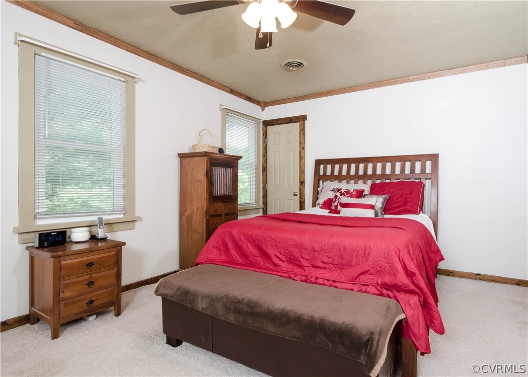 7315 Drexelbrook Road Chesterfield, VA 23832 - Photo 14 of 25 a bedroom with a bed and a chandelier