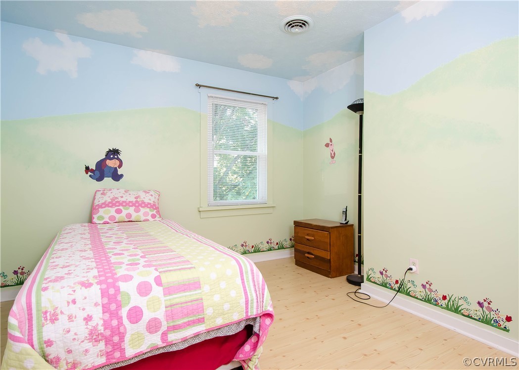 7315 Drexelbrook Road Chesterfield, VA 23832 - Photo 17 of 25 a bedroom with a bed and wooden floor