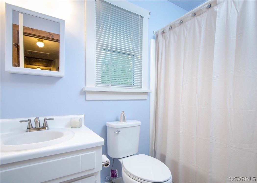 7315 Drexelbrook Road Chesterfield, VA 23832 - Photo 19 of 25 a bathroom with a sink a toilet and a mirror