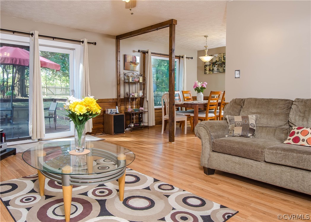 7315 Drexelbrook Road Chesterfield, VA 23832 - Photo 6 of 25 a living room with furniture and a chandelier